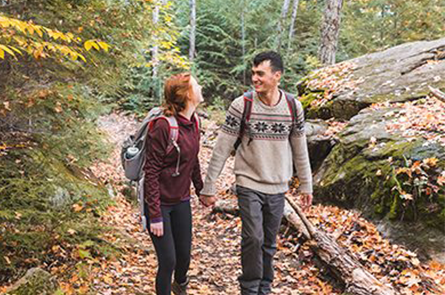 Couple hiking in the woods.