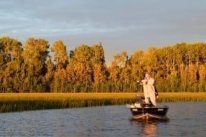 Photo of a Man Fishing at Dusk after a Full Day of Backpacking in Ontario