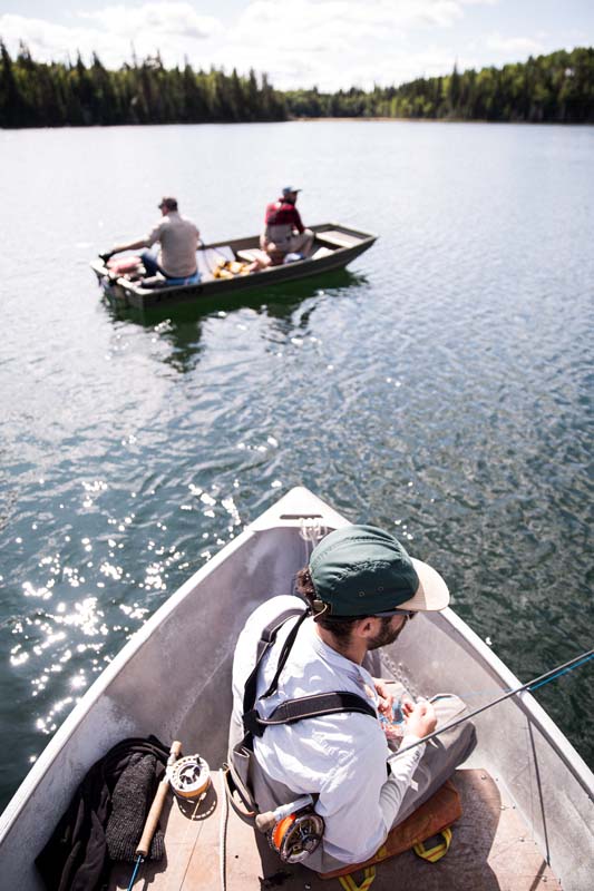 Men fishing in boats.